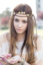 Closeup portrait of beautiful hippie girl with daisies.