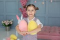 Closeup portrait Beautiful little girl playing with Easter eggs. Family holidays, traditions. Harvesting, little farmer. Hunt East Royalty Free Stock Photo