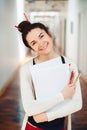 Caucasian young brunette woman student female drawing designer artist in hall of college university Royalty Free Stock Photo