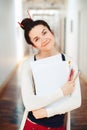 Caucasian young brunette woman student female drawing designer artist in hall of college university Royalty Free Stock Photo