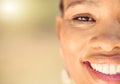 Closeup portrait of a beautiful young African American woman face. Smiling black female showing her healthy teeth and Royalty Free Stock Photo