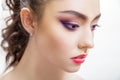 Closeup portrait of beautiful young woman with bright purple makeup and fuchsia lips Royalty Free Stock Photo