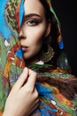 Closeup portrait of beautiful young woman in color veil and jewelry Royalty Free Stock Photo