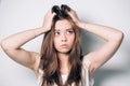 Closeup portrait of the beautiful young woman on the white background. Beautiful young girl looks up, thinks, dreams, doubts. Royalty Free Stock Photo