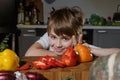 Closeup portrait of boy playing with colorful vegetables