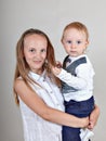 Closeup portrait of a brother and sister. Closeup portrait of a brother and sister. little boy hugging his older sister. Royalty Free Stock Photo