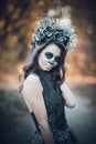 Closeup portrait of Calavera Catrina in black dress. Sugar skull makeup. Dia de los muertos. Day of The Dead. Halloween Royalty Free Stock Photo