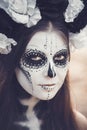 Closeup portrait of Calavera Catrina in black dress. Sugar skull makeup. Dia de los muertos. Day of The Dead. Halloween Royalty Free Stock Photo