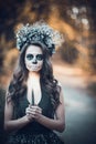 Closeup portrait of Calavera Catrina in black dress. Sugar skull makeup. Dia de los muertos. Day of The Dead. Halloween Royalty Free Stock Photo