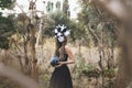 Closeup portrait of Calavera Catrina in black dress. Sugar skull makeup. Dia de los muertos. Day of The Dead. Halloween Royalty Free Stock Photo