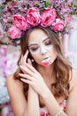 Closeup portrait of Calavera Catrina in pink dress. Sugar skull makeup. Dia de los muertos. Day of The Dead. Halloween Royalty Free Stock Photo