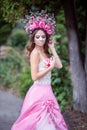 Closeup portrait of Calavera Catrina in pink dress. Sugar skull makeup. Dia de los muertos. Day of The Dead. Halloween