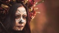 Closeup portrait of Calavera Catrina in red dress. Sugar skull makeup. Dia de los muertos. Day of The Dead. Halloween Royalty Free Stock Photo