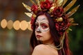 Closeup portrait of Calavera Catrina in red dress. Sugar skull makeup. Dia de los muertos. Day of The Dead. Halloween Royalty Free Stock Photo