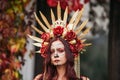 Closeup portrait of Calavera Catrina in red dress. Sugar skull makeup. Dia de los muertos. Day of The Dead. Halloween Royalty Free Stock Photo