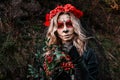 Closeup portrait of Calavera Catrina. Young woman with sugar skull makeup and red flowers. Dia de los muertos. Day of Royalty Free Stock Photo