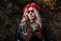 Closeup portrait of Calavera Catrina. Young woman with sugar skull makeup and red flowers. Dia de los muertos. Day of Royalty Free Stock Photo