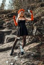 Closeup portrait of Calavera Catrina. Young woman with sugar skull makeup throwing playing cards. Dia de los muertos Royalty Free Stock Photo