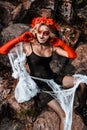 Closeup portrait of Calavera Catrina. Young woman with sugar skull makeup and white spiderweb. Dia de los muertos. Day Royalty Free Stock Photo