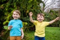 Closeup portrait of Caucasian two little brothers boys laughing outside in park on summer day Royalty Free Stock Photo