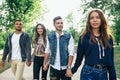 Closeup portrait of Caucasian young men and women friends outdoors