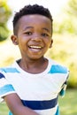 Closeup portrait of cheerful african american cute boy smiling and looking at camera Royalty Free Stock Photo