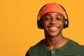 Closeup Portrait Of Cheerful Young African American Man In Wireless Headphones Royalty Free Stock Photo