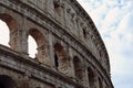 Closeup portrait of Coliseum building old wall with arch in Rome