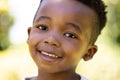 Closeup portrait of cute african american smiling boy looking at camera Royalty Free Stock Photo