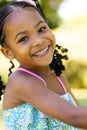 Closeup portrait of cute african american smiling girl looking at camera Royalty Free Stock Photo