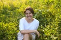 Portrait of cute brunette teen girl walking at meadow field Royalty Free Stock Photo