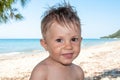 Closeup portrait cute happy baby boy in front of sea Royalty Free Stock Photo