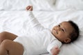 Closeup Portrait Of Cute Little African American Baby Lying On Bed Royalty Free Stock Photo