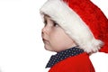Closeup portrait of a cute little baby boy wearing red Santa Claus hat isolated on white background, traditional Christmas costume Royalty Free Stock Photo