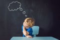 Closeup portrait of Cute little boy thinking deeply about someth Royalty Free Stock Photo