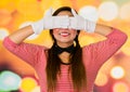 Closeup portrait of cute young girl clown mime covering her eyes