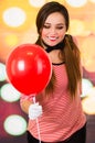 Closeup portrait of cute young girl clown mime holding red balloon Royalty Free Stock Photo