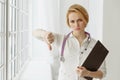 Closeup portrait, doctor woman, giving thumbs down gesture Royalty Free Stock Photo