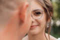 Closeup portrait excited, smiling, saucy curly haired woman in modern eyeglasses with rim looking at camera. Bad vision