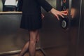 Closeup portrait of a female finger pushing elevator button. Royalty Free Stock Photo