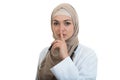 Closeup portrait of friendly, confident muslim with hijab doctor showing shh sigh, silence.