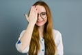 Closeup portrait of friendly, smiling confident female doctor, healthcare professional with labcoat and hand covering Royalty Free Stock Photo