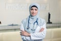 Closeup portrait of friendly, smiling confident muslim female doctor.