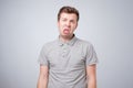 Closeup portrait of funny angry young bully man sticking his tongue out at you camera gesture Royalty Free Stock Photo