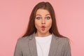 Closeup portrait of funny woman in business suit making fish face with pout lips, looking with humorous grimace Royalty Free Stock Photo