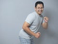 Happy Funny Asian Man Dancing Full of Joy Royalty Free Stock Photo