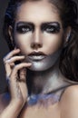Closeup portrait of girl with silver makeup