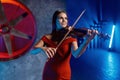 Closeup portrait of gorgeous elegant woman playing violin Royalty Free Stock Photo