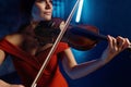 Closeup portrait of gorgeous elegant woman playing violin Royalty Free Stock Photo