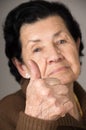 Closeup portrait of grandma old woman holding Royalty Free Stock Photo